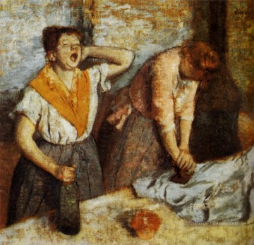 Femme repassage 1884 Edgar Degas Peinture à l'huile